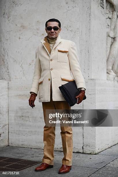 Antonio Nieto poses wearing a Ciffonelli coat and Hackett pants during day 2 of Milan Menswear Fashion Week Fall/Winter 2015/2016 on January 18, 2015...