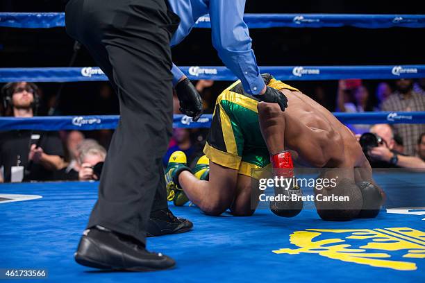 Lekan Aken Byfield rolls on the ground after receiving the fight's finishing blow by Brandon Adams in the 2nd round during ESPN's Friday Night Fights...