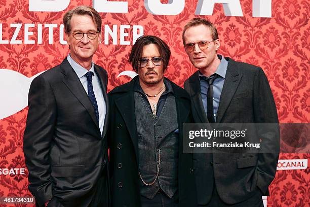 David Koepp, Johnny Depp and Paul Bettany attend the world premiere of the film 'Mortdecai - Der Teilzeitgauner' at Zoo Palast on January 18, 2015 in...