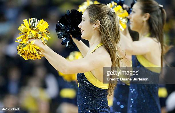 Members of the Michigan Wolverines dance team entertain the fans during the second half of a game against the Coppin State University Eagles at...