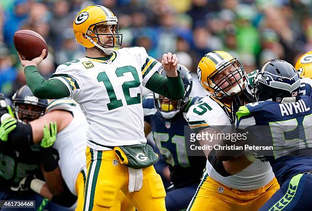 Aaron Rodgers of the Green Bay Packers passes the ball during the first half of the 2015 NFC Championship game against the Seattle Seahawks at...