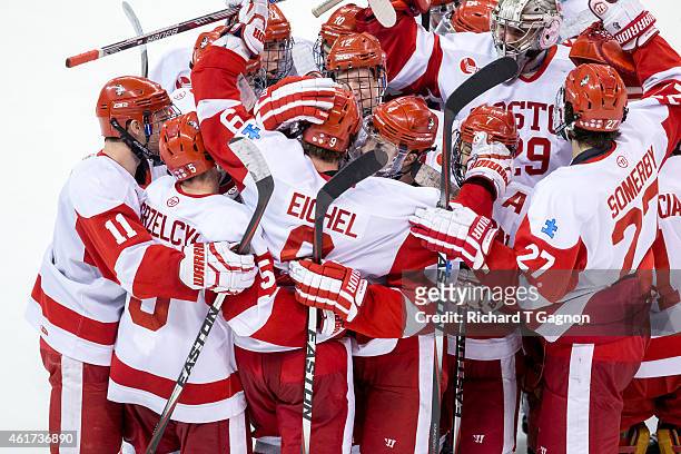 Jack Eichel of the Boston University Terriers celebrates his overtime winning goal with his teammate during NCAA hockey against the Massachusetts...