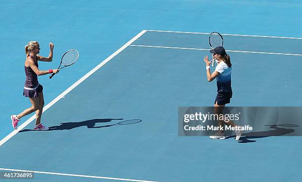 Monica Niculescu of Romania and Klara Zakopalova of the Czech Republic celebrate after winning their doubles final match against Lisa Raymond of the...