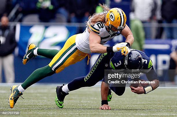 Clay Matthews of the Green Bay Packers tackles Russell Wilson of the Seattle Seahawks durnig the third quarter of the 2015 NFC Championship game at...
