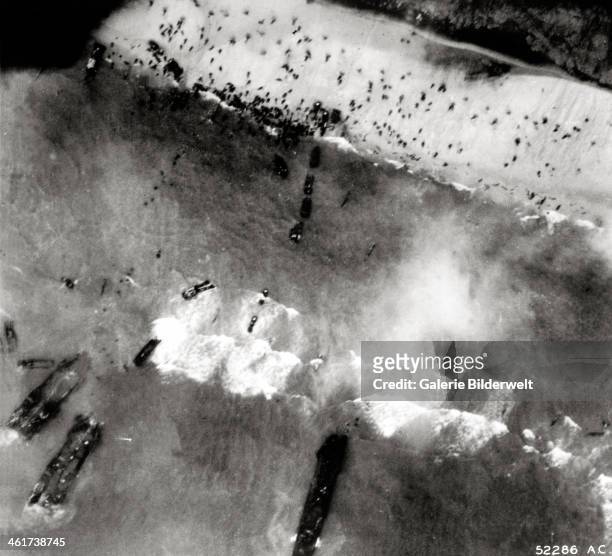 Aerial view of the first landing with landing craft and allied soldiers. 6th June 1944. Utah Beach, Normandy, France.