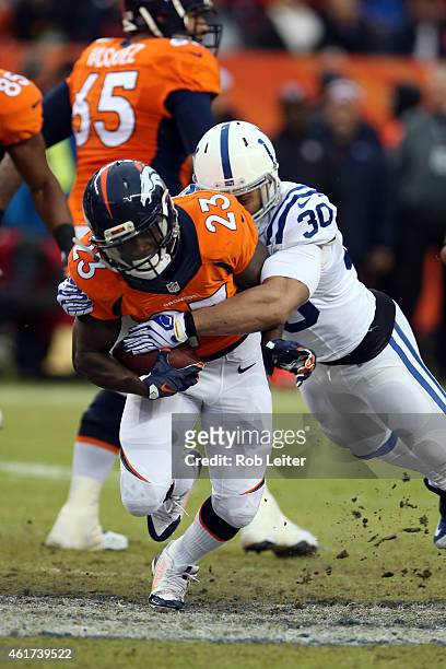 Ronnie Hillman of the Denver Broncos runs the ball as LeRon Landry make the tackle during the game against the Indianapolis Colts during the 2015 AFC...