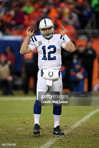 Andrew Luck of the Indianapolis Colts signals touchdown during the game against the Denver Broncos during the 2015 AFC Divisional Playoff game at...