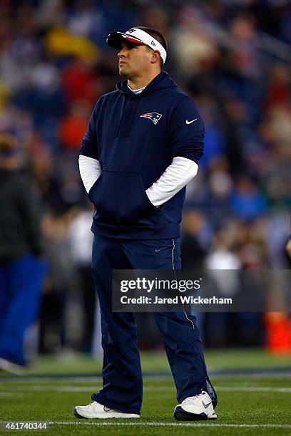 Offensive Coordinator Josh McDaniels of the New England Patriots looks on during warm-ups prior to the 2015 AFC Championship Game against the...