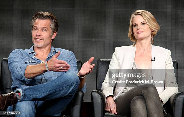 Actors Timothy Olyphant and Joelle Carter speak onstage during the 'Justified' panel discussion at the FX Networks portion of the Television Critics...