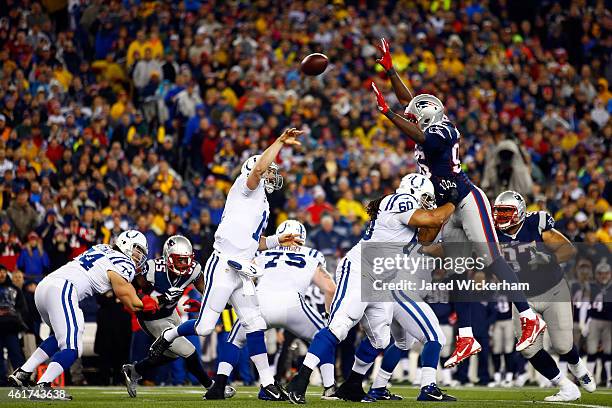 Andrew Luck of the Indianapolis Colts passes against Chandler Jones of the New England Patriots in the first half of the 2015 AFC Championship Game...