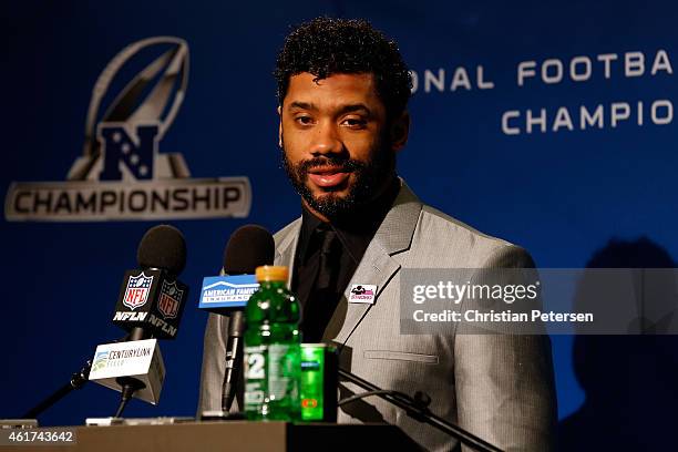 Russell Wilson of the Seattle Seahawks speaks to the media after defeating the Green Bay Packers 28-22 in the 2015 NFC Championship game at...