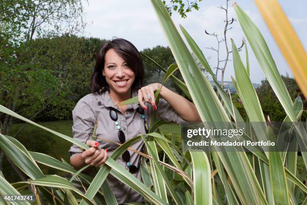 The Italian politician Nunzia De Girolamo smiles wearing a big engagement ring in the garden of her house in Benevento. She is engaged with the...