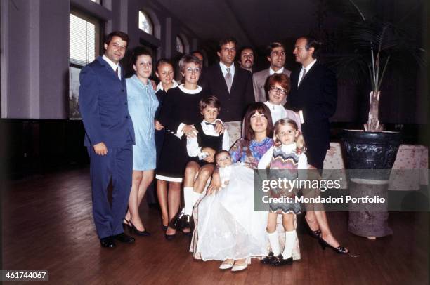 Group shot for the Italian cinematographic actor Giuliano Gemma and his wife, the painter Natalia Roberti, posing with relatives and friends in the...