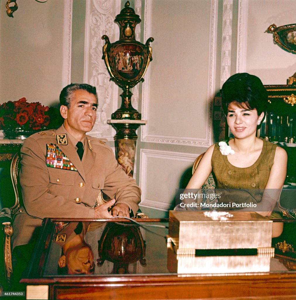 Mohammad Reza Pahlavi and Farah Diba sitting in the study of the Royal Palace