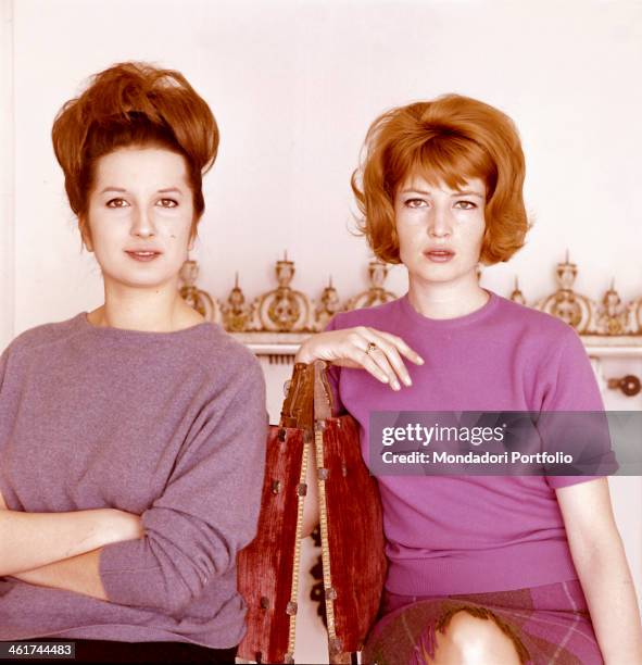 The Italian singer Mina is posing next to the Italian actress Monica Vitti on the set of the film Eclipse, directed by Michelangelo Antonioni; Mina...