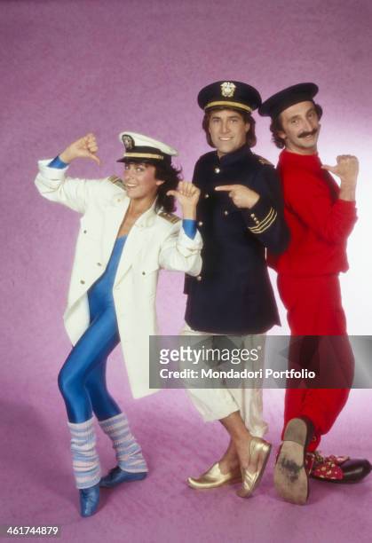 Angela Brambati, Franco Gatti and Angelo Sotgiu, members of the Italian band Ricchi e Poveri, posing wearing stage costumes. Italy, 1984