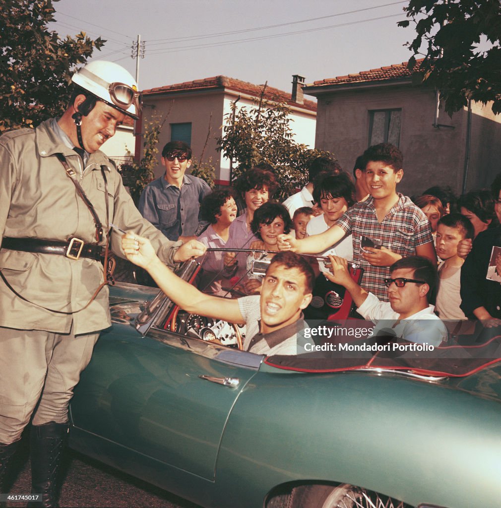 Adriano Celentano greeting some young fans