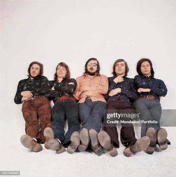 Italian band Nomadi posing sitting with folded arms on a photo set. The band is composed by Italian singer Augusto Daolio, Italian keyboard player...