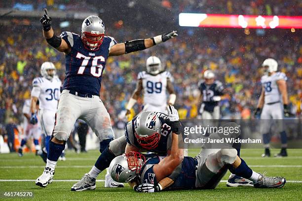Nate Solder of the New England Patriots celebrates his third quarter touchdown with Sebastian Vollmer and Dan Connolly against the Indianapolis Colts...