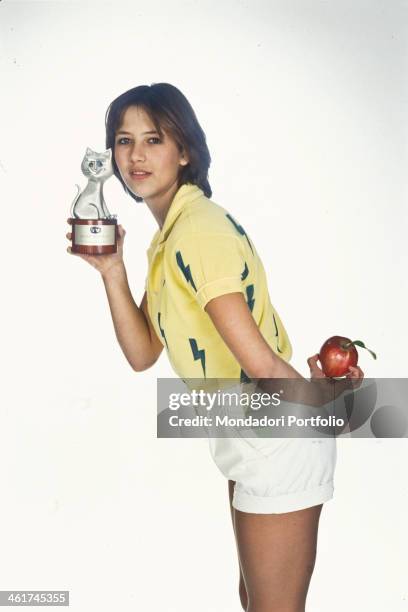 French actress Sophie Marceau posing with the Telegatto award won for the film The Party. 1982