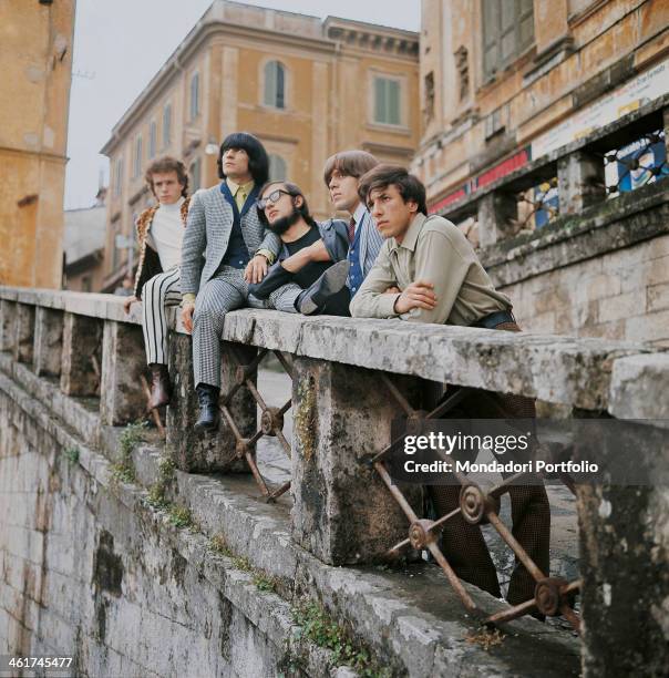 Italian band Nomadi posing on a bridge. The band is composed by Italian singer Augusto Daolio, Italian keyboard player Beppe Carletti , , Italian...