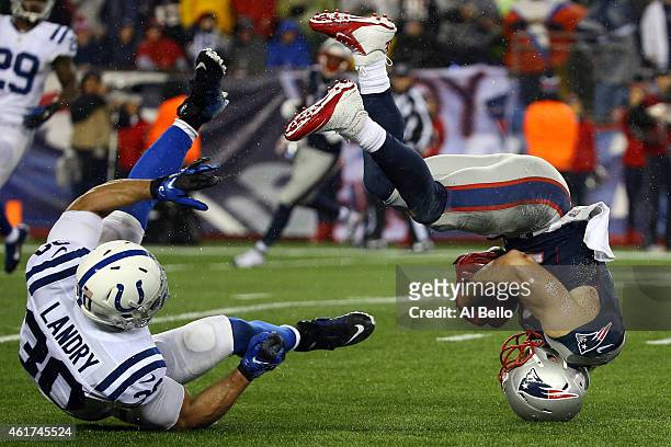 Julian Edelman of the New England Patriots makes a catch against LaRon Landry of the Indianapolis Colts in the third quarter of the 2015 AFC...