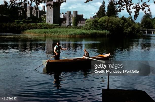Boat trip in the waters of Lough Corrib. In the background, Ashford Castle. Cong, 1965