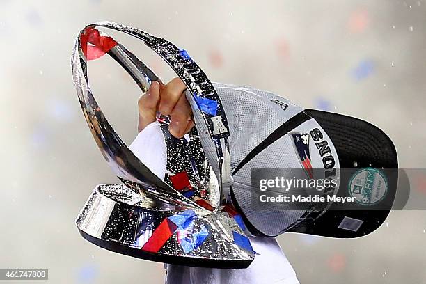 Tom Brady of the New England Patriots holds up the Lamar Hunt Trophy after defeating the Indianapolis Colts in the 2015 AFC Championship Game at...