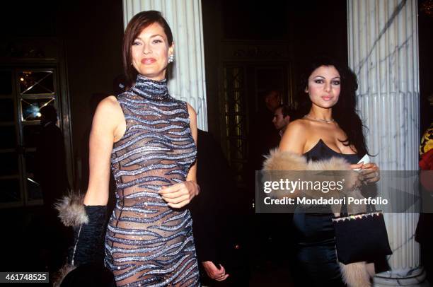 American model Carol Alt, in a blue dress partially transparent, is taken in the foyer of the La Scala theatre for a charity concert for the children...