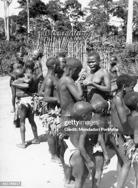 Some young people belonging to a tribe of Mbuti pygmies; Mbuti pygmies, who live in the area between Beni and Irumu, are one of the oldest indigenous...