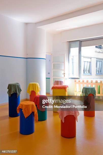 The coloured and welcoming interiors at Il Germoglio crèche. Milan, Italy. 2013