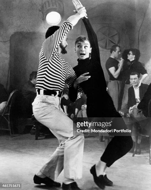 British actress Audrey Hepburn dancing in the film Funny Face. Paris, 1956