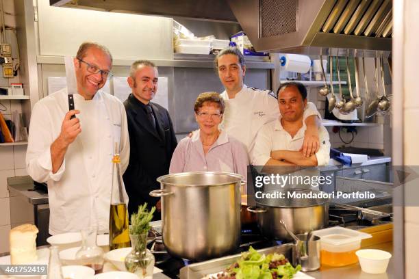 The chef Nicola Batavia with his mother Maria and his staff during a photo shooting at the restaurant 'l Birichin. Turin, Italy. 8th June 2012