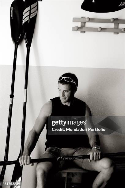 The canoeist Antonio Rossi during a photo shooting. Lago di Pusiano, Italy. 2008