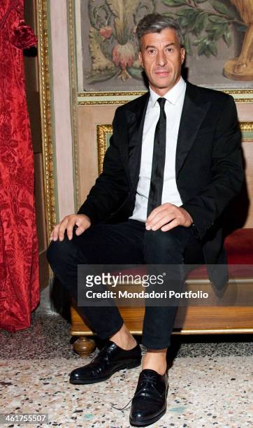 Italian artist Maurizio Cattelan posing on the opening night of his exhibition in Palazzo Reale in Milan , on September 24th, 2010.