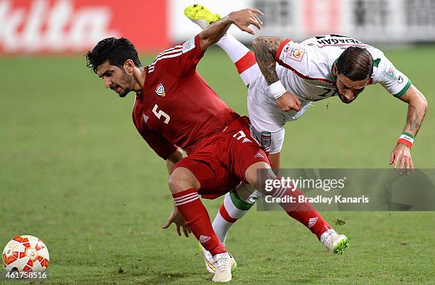 Amer Abdulrahman of the United Arab Emirates and Ashkan Dejagah of Iran challenge for the ball during the 2015 Asian Cup match between IR Iran and...