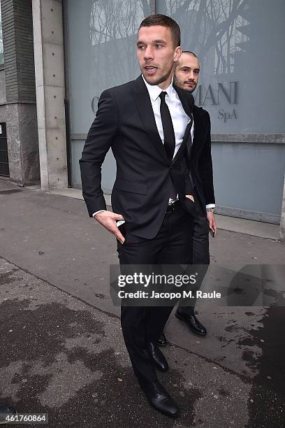 Lukas Podolski is seen leaving the the Emporio Armani Show as a part of Milan Menswear Fashion Week Fall Winter 2015/2016 on January 19, 2015 in...