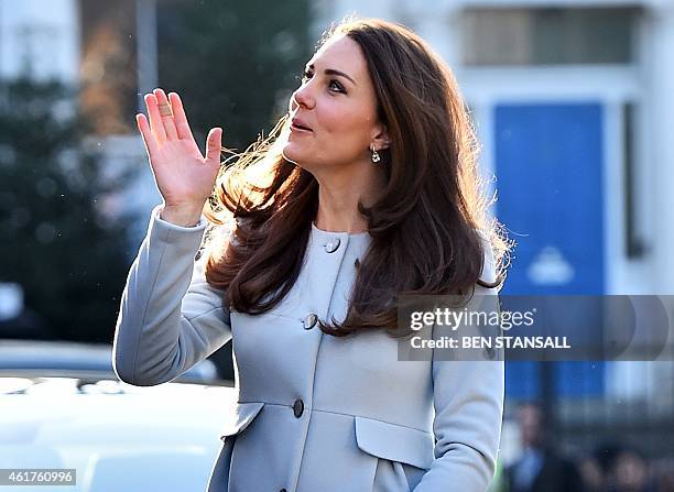 Brtiain's Catherine, Duchess of Cambridge, arrives to attend a coffee morning at Family Friends, a voluntary organisation providing mentoring...