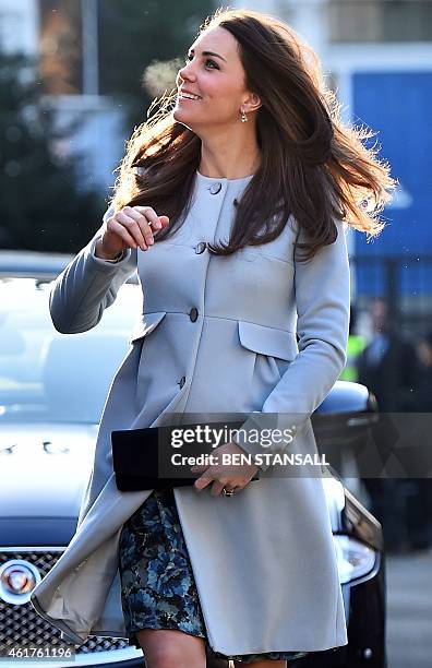 Brtiain's Catherine, Duchess of Cambridge, arrives to attend a coffee morning at Family Friends, a voluntary organisation providing mentoring...