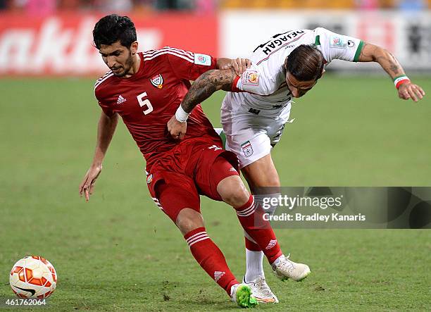 Amer Abdulrahman of the United Arab Emirates and Ashkan Dejagah of Iran challenge for the ball during the 2015 Asian Cup match between IR Iran and...