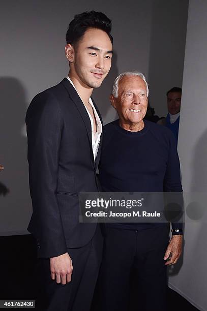 Ethan Ruan and Giorgio Armani attend the Emporio Armani Show as a part of Milan Menswear Fashion Week Fall Winter 2015/2016 on January 19, 2015 in...