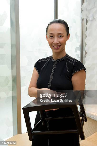 September 15: Shangxia CEO and Artistic Director JIANG Qiong Er poses with a Ming Dinasty style stool priced at 24,000 Yuans in the first store of...