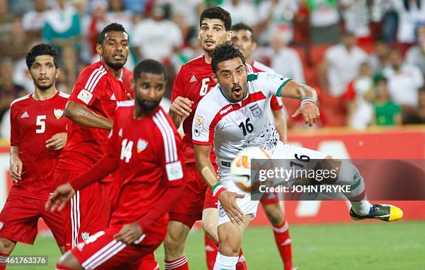 Reza Ghoochannejhad of Iran fights the United Arab Emirates defence for the ball during their Group C football match at the AFC Asian Cup in Brisbane...