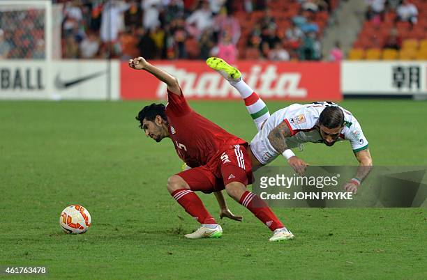 Amer Abdulrahman of United Arab Emirates and Ashkan Dejagah of Iran fight for the ball with during their Group C football match at the AFC Asian Cup...