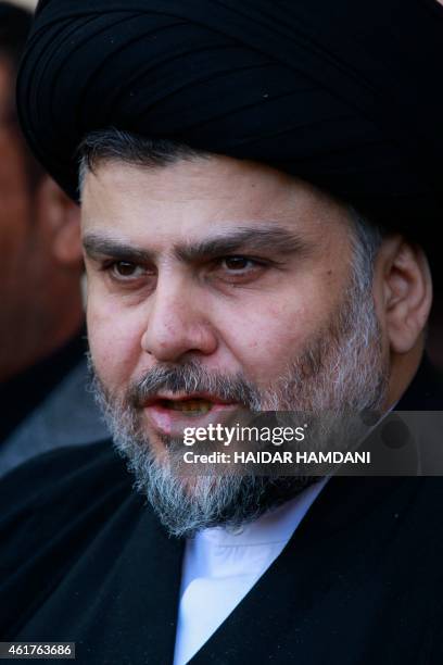 Iraqi Shiite cleric Moqtada al-Sadr speaks during a press conference with Iraqi Defence Minister Khaled al-Obeidi after their meeting on January 19,...
