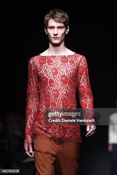 Model walks the runway during the GUCCI show as a part of Milan Menswear Fashion Week Fall Winter 2015/2016 on January 19, 2015 in Milan, Italy.