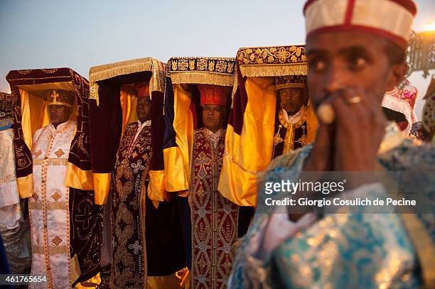 Priests dressed with traditional clothes carry the Tabot over their heads as they attend the Timkat celebration on January 18, 2015 in Addis Ababa,...
