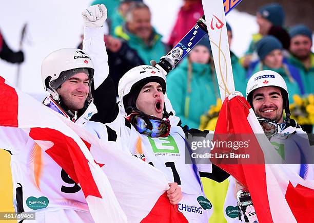 Mikael Kingsbury of Canada celebrates with third placed Marc-Antoine Gagnon of Canada and second placed Philippe Marquis of Canada after winning the...