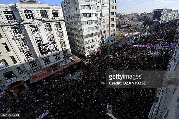 Turkish people march to the office of Armenian newspaper "Agos" during a commemoration ceremony for slain journalist Hrant Dink, in Istanbul, on...