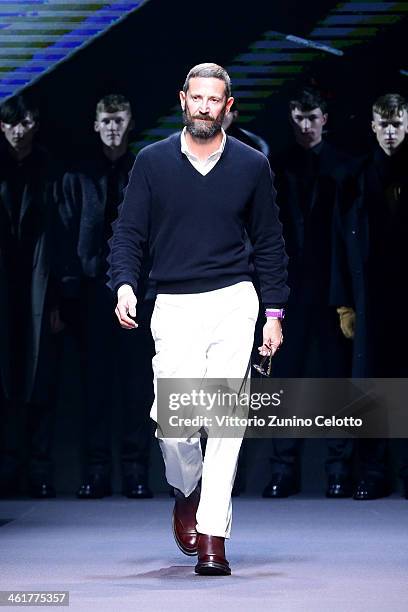 Italian fashion designer Stefano Pilati acknowledges the applause of the audience at the end of the Ermenegildo Zegna show as a part of Milan Fashion...